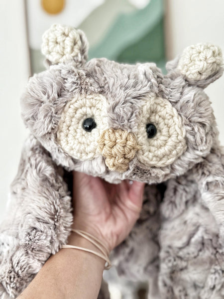 A plush owl lovey handmade by ClaraLoo with ultra plush faux fur and cream colored crochet accents.