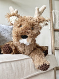A plush deer with brown faux fur and crocheted accents.
